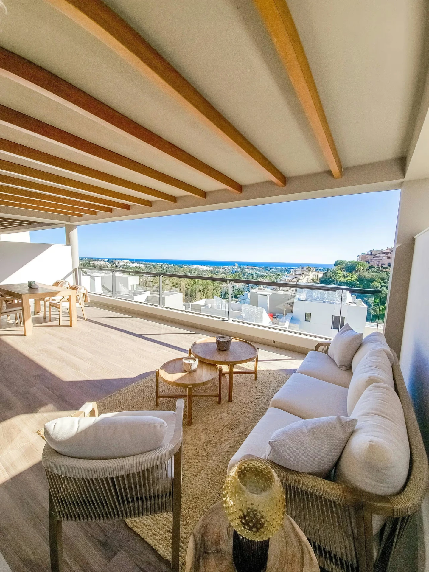 Covered terrace lounge overlooking the Costa del Sol